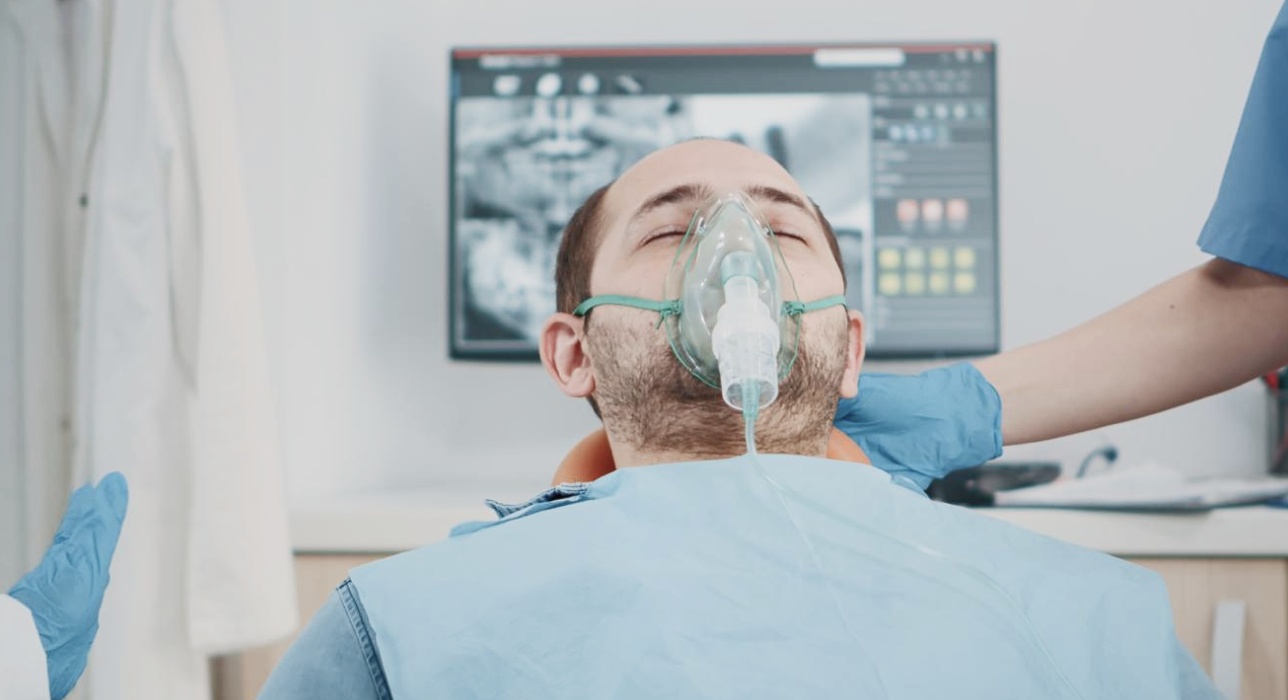 Patient relaxed in dental chair during sedation dentistry in Middletown, OH